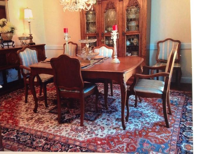 Dining room table with 2 additional leaves, 5' x 42", comes with 6 chairs, 2 are armchairs.