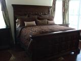 gorgeous king bed with headboard, comforter, sheets, pillows, even window drapes