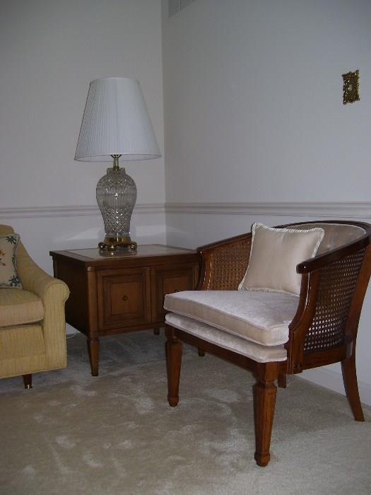 The other marble top end table with an armchair