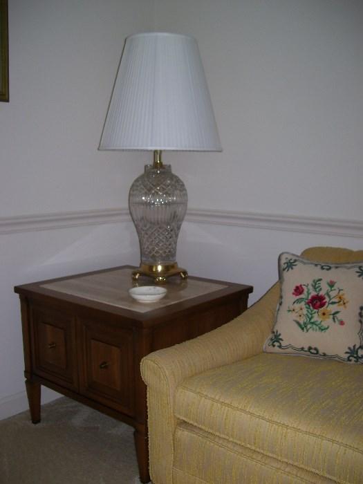 One of a pair of marble top end tables and a pair of table lamps
