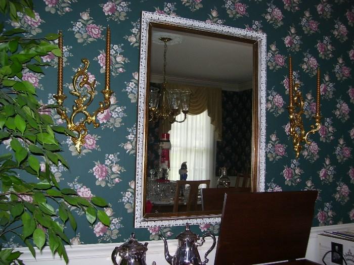 Framed mirror and wall sconces