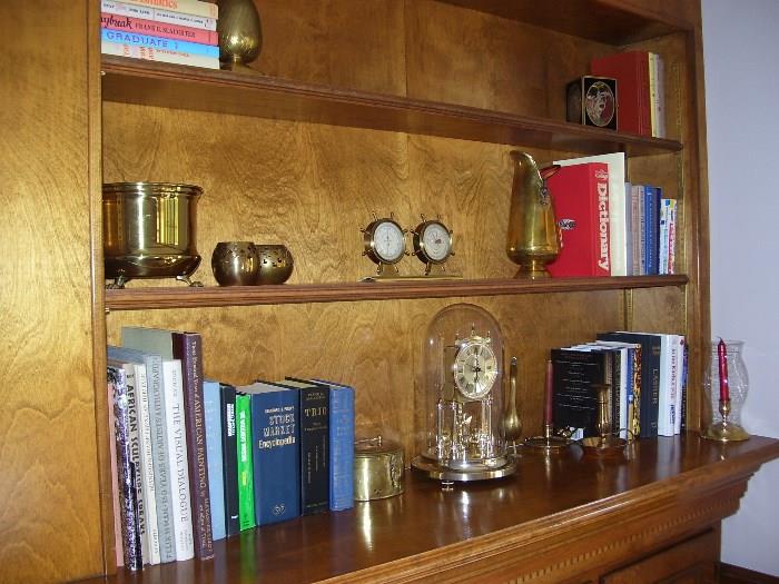 Books, brass items and clock