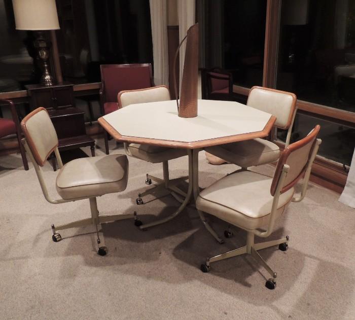 Kitchen or game table, four chairs with wheels