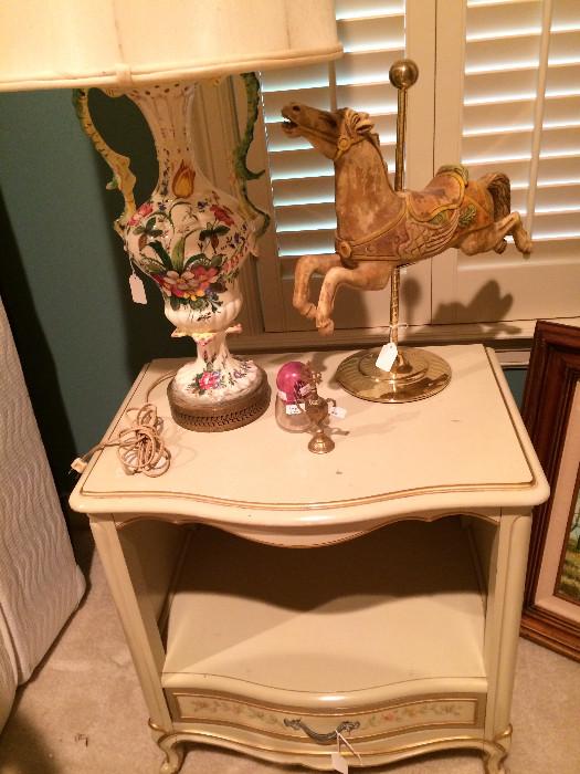 White French provincial nightstand; decorative lamp; carrousel horse