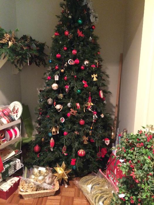 Fully-decorated Christmas tree; many accessories