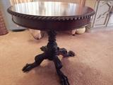 Antique table.  Look at those claw feet
