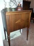 Singer sewing machine in cabinet