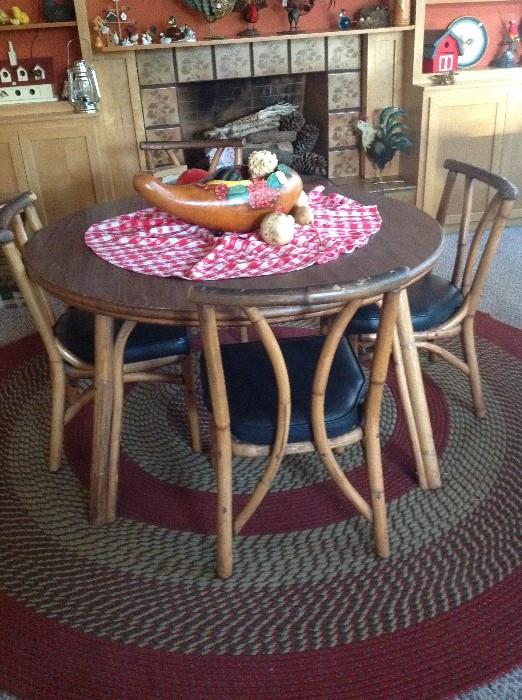 Rattan game table and four chairs.  Also suitable for dining.