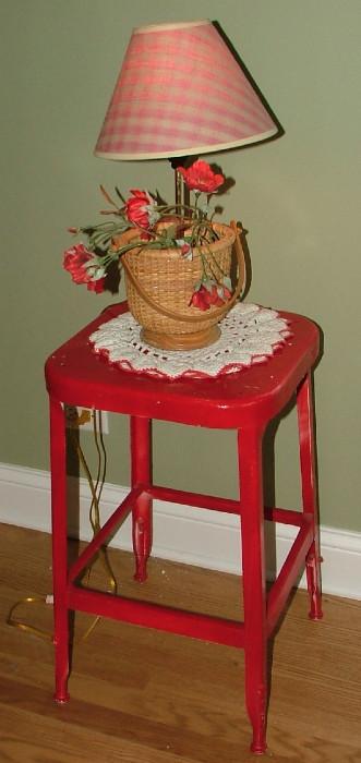 Antique Metal Stool, painted Fire Engine Red.  The lamp reminds me of a Nantucket Basket converted to a lamp.  