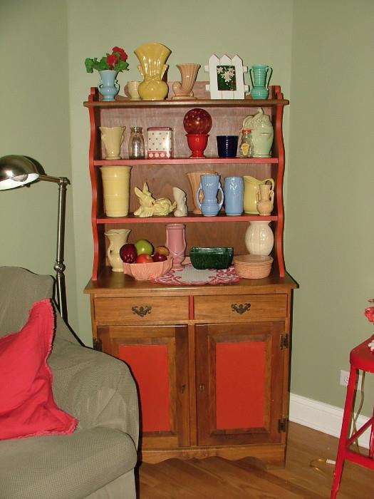 This is one darling Cabinet - love how it's painted with red highlights...a great way to display all that Shawnee, McCoy, Hull and more Pottery