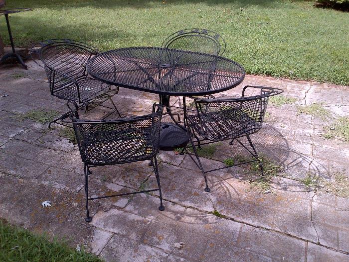 Wrought-iron patio table with four chairs.