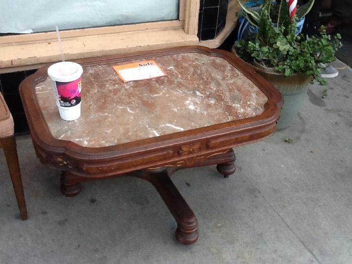 Cherry with Marble top coffee table with rollers only asking $125