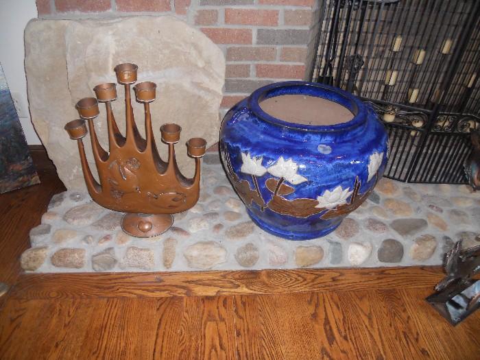 very large copper candle holder and 1 of a pair of very large ceramic planters
