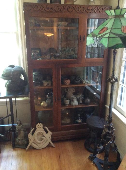 Antique cabinet filled with antiquities and artifacts