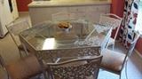 Glass top cast iron table w/6 chairs.