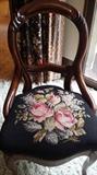 Many chairs-needle point, wicker and bentwood.