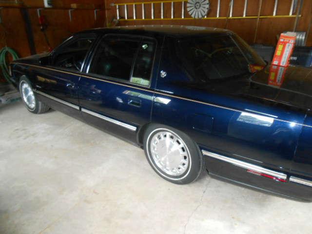 1997 Cadillac Sedan Deville, approx 28.5K miles, beautiful condition, open for highest bid on Friday.