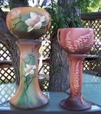 Roseville Pottery jardinières: 30 Inch Tall "Magnolia" #665-10 jardinière & pedestal (minor flakes on flowers); 24" Tall "Foxglove" #659-8 jardinière & pedestal (excellent)