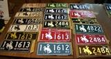 Wyoming license plates in excellent condition: single 1949 & 24 pairs from 1950 to 1968 (except 1952 & 1957), most with mailing envelopes
