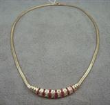 Woven 14k yellow gold ruby and diamond necklace with current appraisal