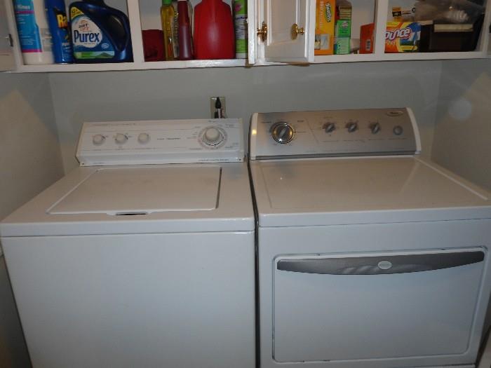 Washer/Dryer and lots of cleaning supplies..