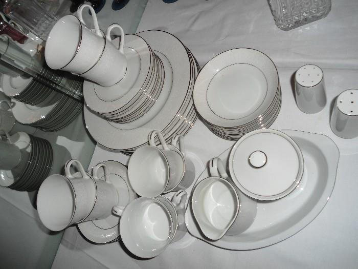 Another set of dishes...White w/silver rim and also white with gold rim...Several other sets..