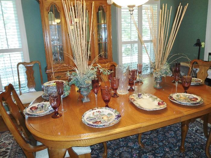 Oak Dining Room Table and Matching Chairs,  Matching Lighted Oak Hutch with glass shelves and storage cabinets....