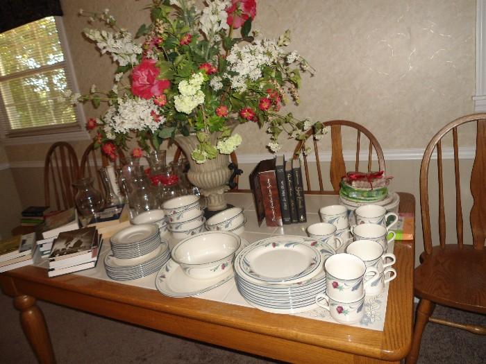 Several sets of dishes, glassware, Beautiful Flower Arrangement purchased from many local designers.  Sizing way down and this will not fit in small home.