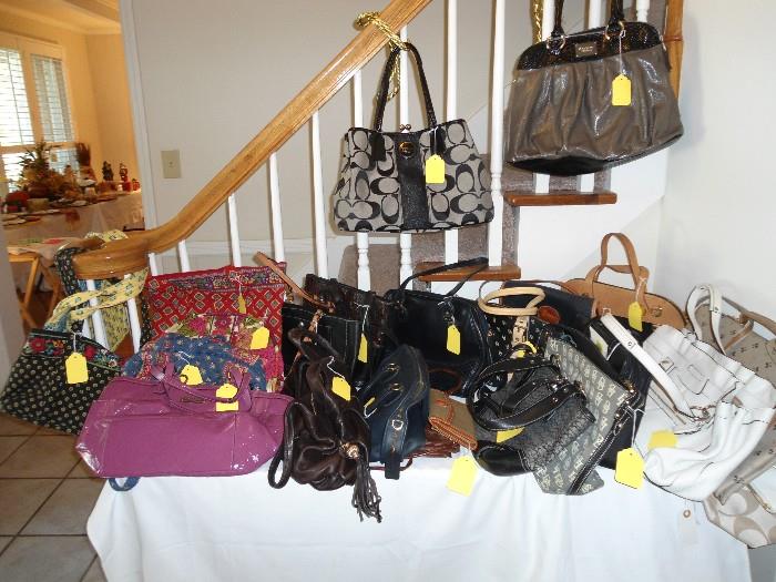 Designer Handbags:  Coach, Dooney & Bourke, Brahmin, Vera Bradley, Channel, Nine West, etc...Brand names that you will recognize costing hundreds of dollars each....Slightly used...Most look BRAND NEW...Come take a look and compare...Always wanted to own a designer bag but like to stretch your dollar, then come check out this sale...  
