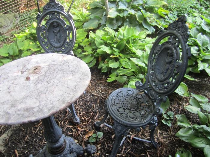 TABLE AND PAIR OF WROUGHT IRON CHAIRS