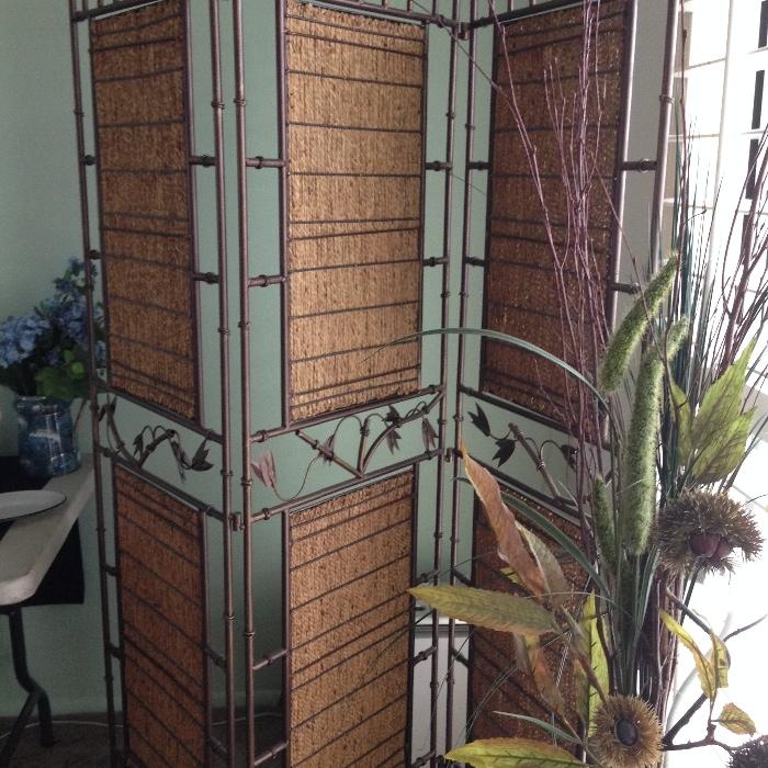 wrought iron and woven panel room divider