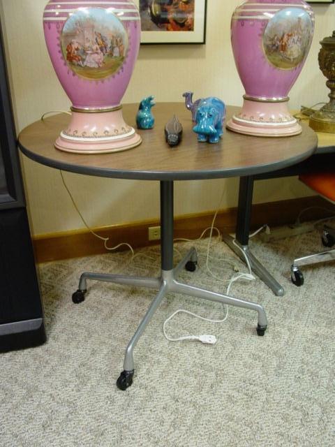 Herman Miller round table.  Pink lamps are not for sale.