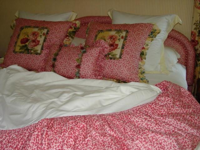 Custom made pillows and king size dust ruffle to accompany custom upholstered king size headboard.