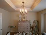 sweedish antique bureau And French crystal chandelier with amethyst crystals bolts of high end fabric home owner is a respected designer. 