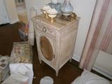 There is a pair of night stands French in origin with marble tops