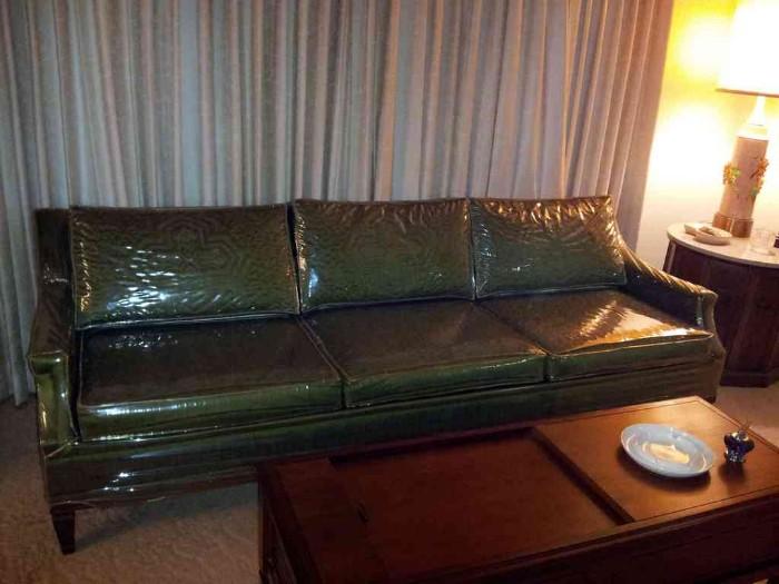 Mid-century sofa with vinyl slipcover