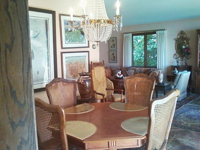 DIning table, chairs, prints, rugs.