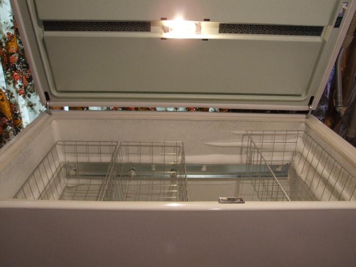 INSIDE SEARS CHEST FREEZER. COMES WITH EXTRA STORAGE WIRE TRAYS TOO!!