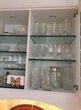 Kitchen glassware, pitchers, tumblers and wine glasses. 