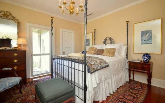 SOUTHEASTERN NEWER METAL FOUR POSTER BED WITH BEAUTIFUL LINENS AND ANTIQUES