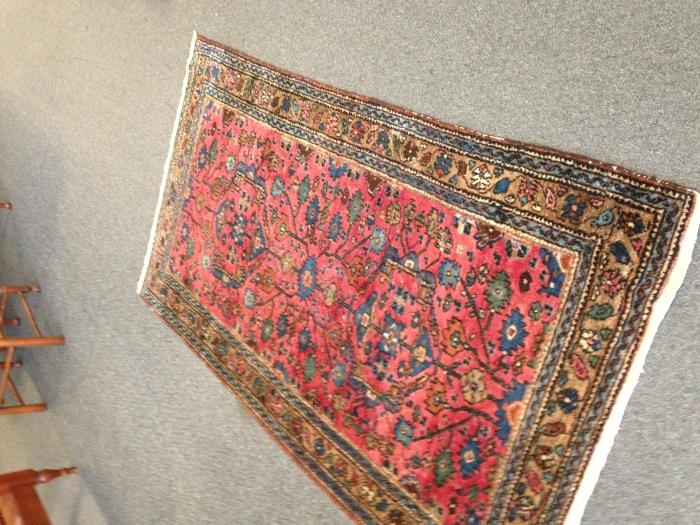 One of several small oriental rugs.