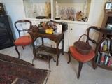 Antique table with 2 red side chairs