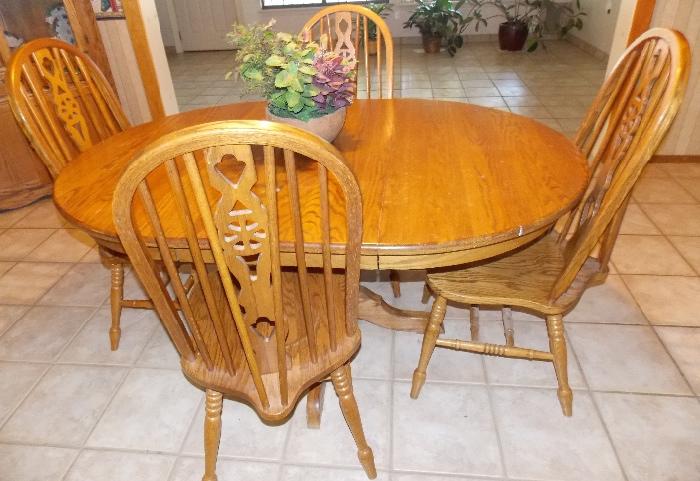 Oak dining table and 4 chairs 