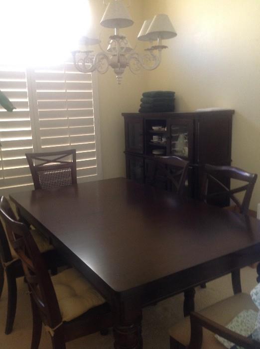 Wood table, 2 leaves and 6 chairs from Mathis Brothers with matching china cabinet