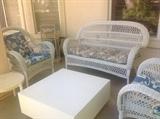 White wicker patio furniture, tables