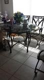 Wrought iron glass top dining set, 4 chairs and Baker's Rack