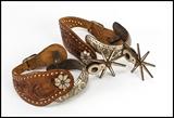 Mexican Chihuahua-style silver inlaid spurs c. 1940s,
total length 10 in. including strap
Auction estimate: $250 - 400