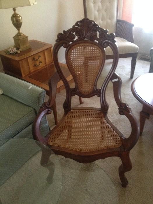 1 of a pair of Carved Victorian  Caned Arm Chairs