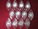 12 Days of Christmas Ornaments Franklin Mint.  These have 12 Troy Ounces of Sterling in Lucite issued in 1970