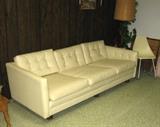 Leather type sofa, it's got that mid-century-look 